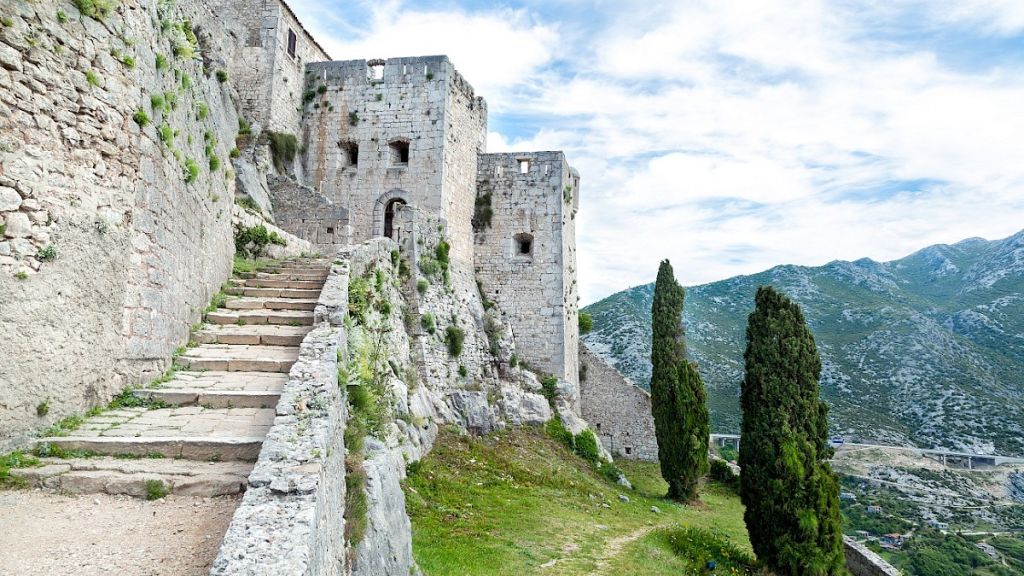 Popular Game of Thrones filming location - Klis Fortress in Croatia - a luxury yacht charter destination for summer vacation